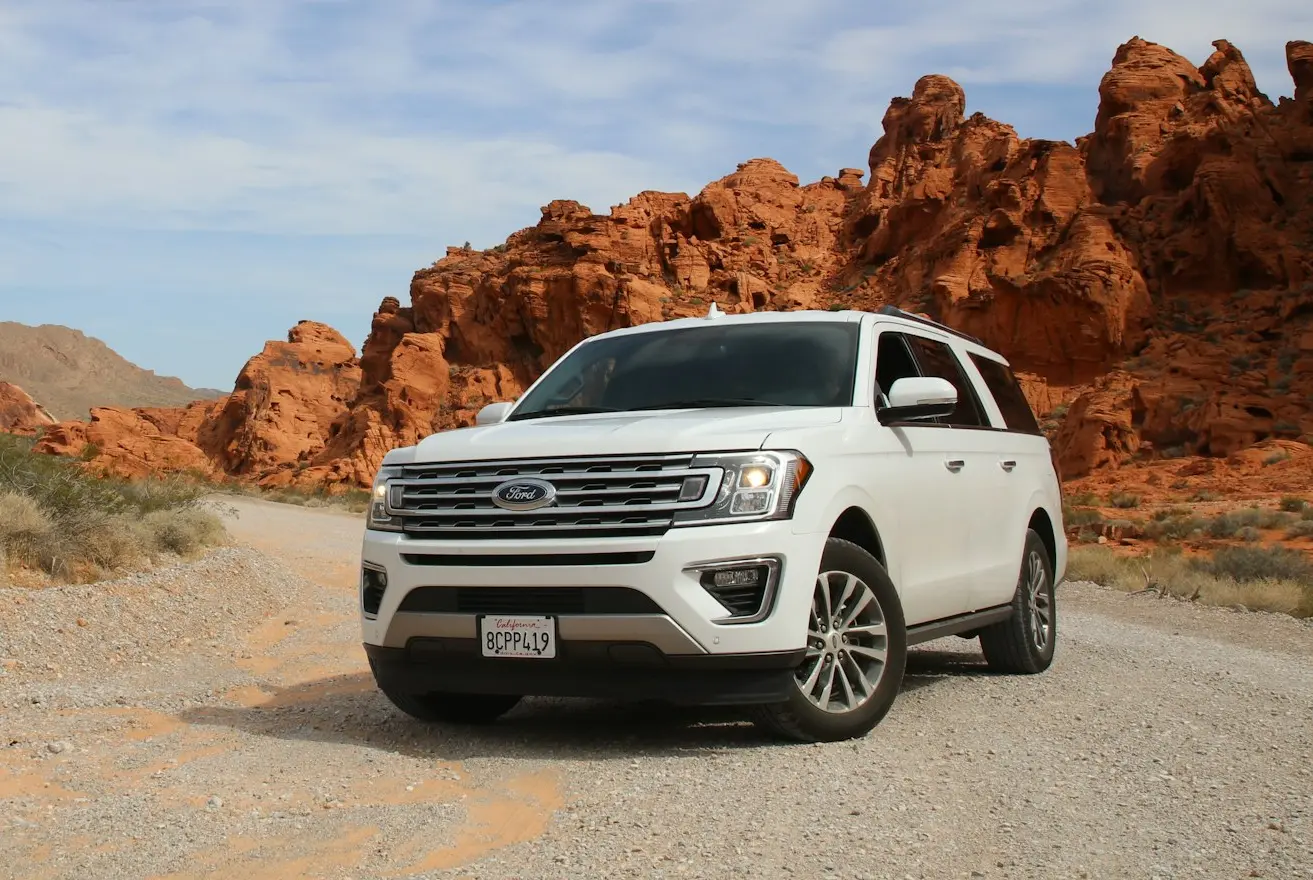 parked white Ford Explorer SUV