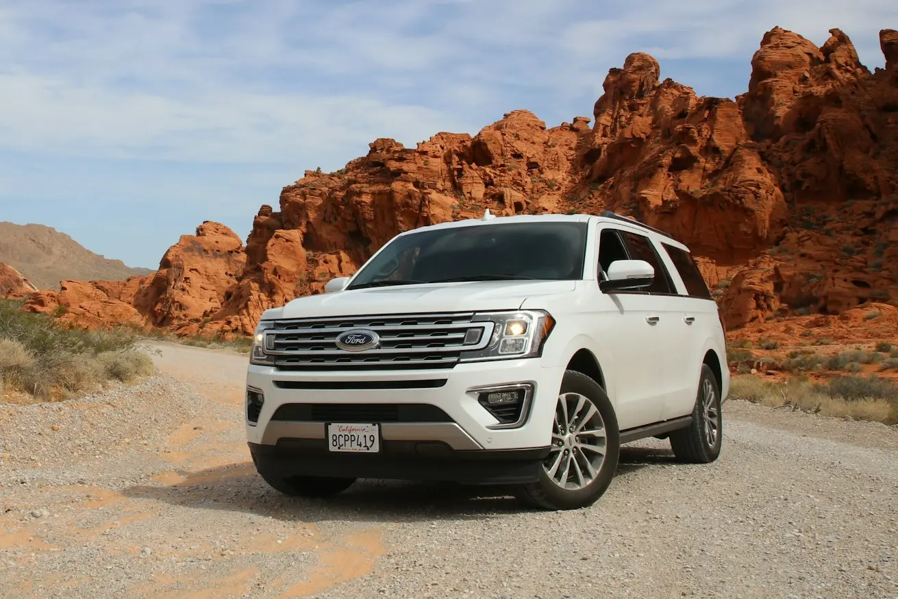 parked white Ford Explorer SUV